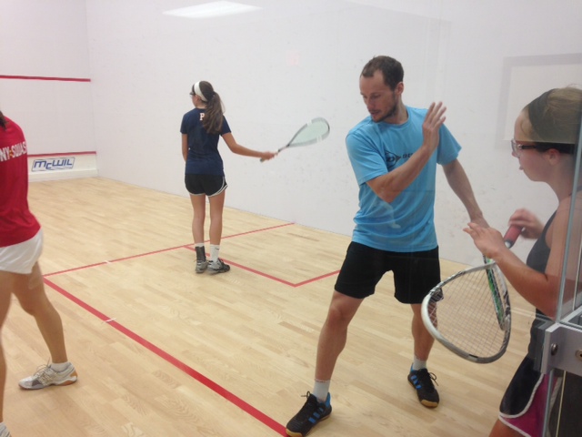 Squash players are coached by Greg Gaultier at a squash camp at the sport courts in Toronto