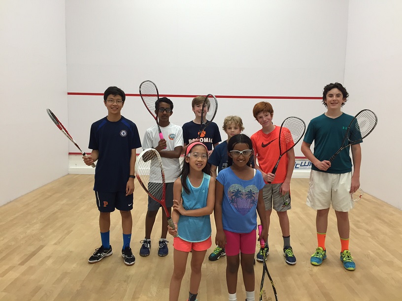 Photo of squash junior players on a squash court in DC