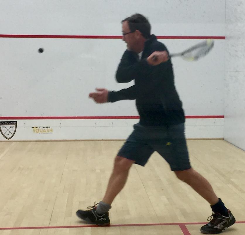 Photo of squash coach Ned Sparrow coaching juniors on the squash club in Baltimore
