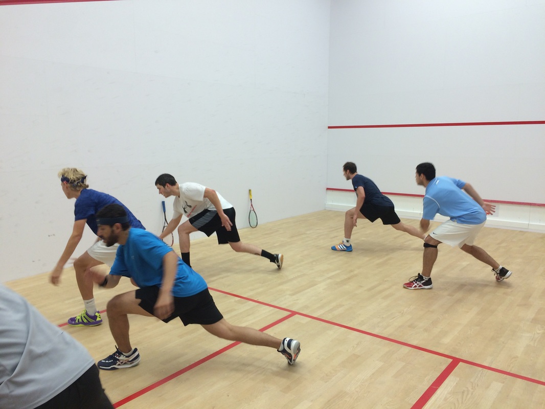 Junior squash players on the squash game court in DC