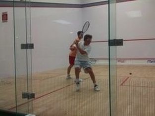 Two players in a squash match round robin in DC