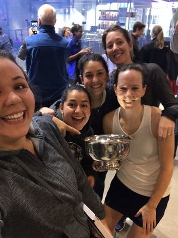 Picture of the A squash team winning the Howe Cup