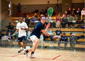 James Reiss plays squash on the squash court in DC